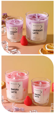 Two sets of lavender and sakura latte candles with visible labels on a decorative background.