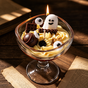 Happy Haunting Ghost Dessert Candle - lit close up